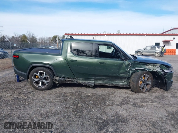 2022 Rivian R1T Adventure z VIN 7FCTGAAA8NN015369, wystawiony jako IAAI lot #41407842 z przebiegiem 22 507 mil mil oraz . Historia ofert i sprzedaży dostępna na DreamBid. Obrazek 13.