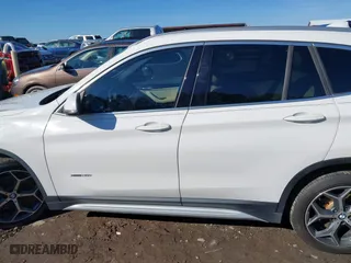 2017 BMW X1 xDrive28i with VIN WBXHT3C37H5F69725, listed as a IAAI auction lot 41588095 with 109,704 mi miles. Bid and sale history available at carsss.com. Image 14.