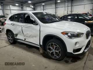 2017 BMW X1 xDrive28i with VIN WBXHT3Z38H4A53824, listed as a Copart auction lot 52500215 with 106,782 mi miles and Salvage title. Bid and sale history available at DreamBid. Image 4.