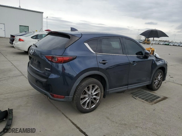 2021 Mazda CX-5 Grand Touring with VIN JM3KFADM8M1321415, listed as a Copart auction lot 47685415 with 90,145 mi miles and Salvage Title. Bid and sale history available at carsss.com. Image 3.