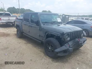 2023 Jeep Gladiator Sport S with VIN 1C6HJTAG7PL522721, listed as a IAAI auction lot 42594463 with 64,702 mi miles and . Bid and sale history available at DreamBid. Image 1.