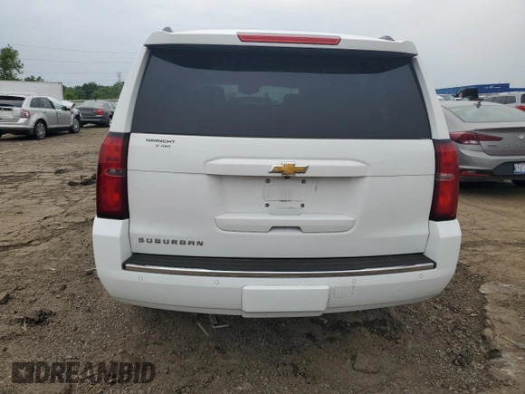 2015 Chevrolet Suburban LT z VIN 1GNSKJKC5FR261474, wystawiony jako Copart lot #60679775 z przebiegiem 128 851 mil mil oraz Czysty tytuł • Clean title. Historia ofert i sprzedaży dostępna na DreamBid. Obrazek 6.