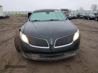 2015 Lincoln MKS with VIN 1LNHL9DK7FG606935, listed as a Copart auction lot 81991384 with 82,097 mi miles and Salvage Title. Bid and sale history available at carsss.com. Image 5.