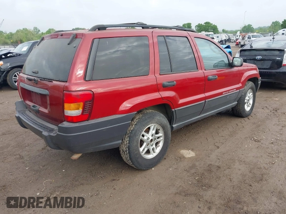 2004 Jeep Grand Cherokee Laredo with VIN 1J4GW48S64C371253, listed as a IAAI auction lot 42099607 with 260,618 mi miles. Bid and sale history available at carsss.com. Image 4.