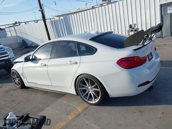 2018 BMW 4 Series 430i with VIN WBA4J1C59JBG77470, listed as a IAAI auction lot 41534689 with 141,710 mi miles and . Bid and sale history available at carsss.com. Image 14.