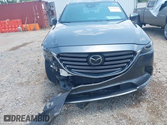 2018 Mazda CX-9 Grand Touring with VIN JM3TCADY7J0217595, listed as a IAAI auction lot 42381331 with 130,604 mi miles and . Bid and sale history available at DreamBid. Image 6.