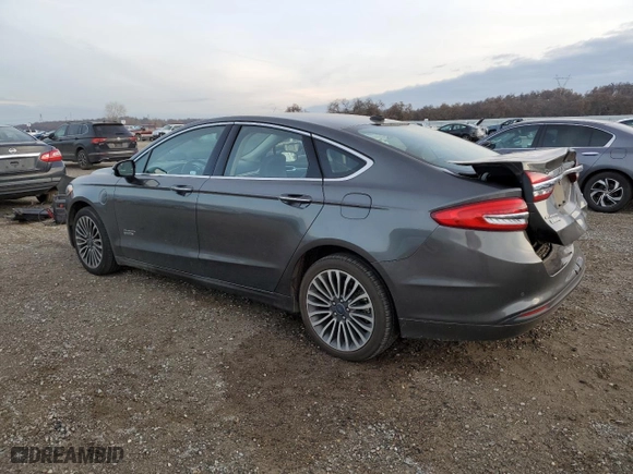 2017 Ford Fusion Energi SE with VIN 3FA6P0PU3HR354658, listed as a Copart auction lot 71824902 with 67,618 mi miles. Bid and sale history available at carsss.com. Image 2.