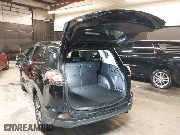 2018 Toyota RAV4 LE with VIN 2T3BFREV7JW768376, listed as a IAAI auction lot 41864571 with 292,147 mi miles. Bid and sale history available at carsss.com. Image 3.