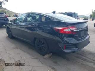 2018 Honda Clarity Plug-In Hybrid with VIN JHMZC5F10JC014054, listed as a IAAI auction lot 41932195 with 100,643 mi miles. Bid and sale history available at carsss.com. Image 3.
