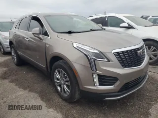 2022 Cadillac XT5 FWD Premium Luxury z VIN 1GYKNCRS1NZ126722, wystawiony jako Copart lot #74231714 z przebiegiem Nie podano mil oraz Nie do naprawy • Non repairable. Historia ofert i sprzedaży dostępna na DreamBid. Obrazek 4.