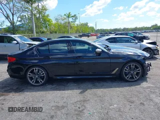2019 BMW 5 Series M550i xDrive with VIN WBAJB9C51KB289355, listed as a IAAI auction lot 41867984 with 30,106 mi miles and . Bid and sale history available at DreamBid. Image 13.