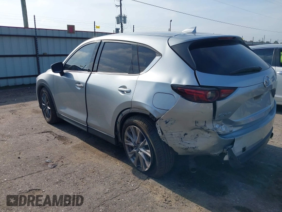 2020 Mazda CX-5 Grand Touring with VIN JM3KFADM5L0739306, listed as a IAAI auction lot 42215667 with 126,100 mi miles and . Bid and sale history available at DreamBid. Image 3.