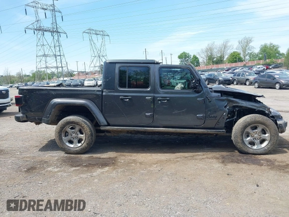 2021 Jeep Gladiator Freedom with VIN 1C6HJTAG3ML557932, listed as a IAAI auction lot 42150245 with 26,656 mi miles and . Bid and sale history available at DreamBid. Image 14.