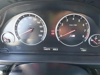 2014 BMW M5 with VIN WBSFV9C55ED593614, listed as a IAAI auction lot 41777369 with 144,076 mi miles. Bid and sale history available at carsss.com. Image 7.