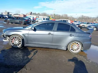 2008 Mitsubishi Lancer Evolution GSR with VIN JA3AW86V18U044077, listed as a IAAI auction lot 41208625 with 157,788 mi miles. Bid and sale history available at carsss.com. Image 14.