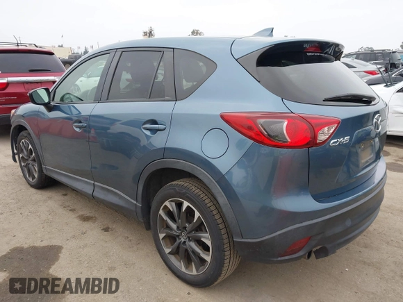 2016 Mazda CX-5 Grand Touring with VIN JM3KE2DY7G0875678, listed as a IAAI auction lot 42104888 with 30,566 mi miles. Bid and sale history available at carsss.com. Image 3.