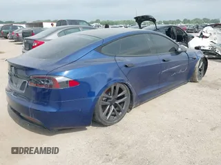 2021 Tesla Model S Plaid with VIN 5YJSA1E64MF442036, listed as a IAAI auction lot 42141304 with 24,998 mi miles and . Bid and sale history available at DreamBid. Image 4.