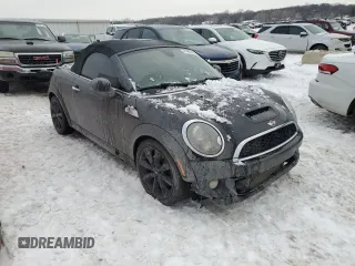 2013 MINI Roadster S z VIN WMWSY3C58DT566208, wystawiony jako Copart lot #41480595 z przebiegiem 119 265 mil mil oraz Szkody całkowita. Historia ofert i sprzedaży dostępna na DreamBid. Obrazek 4.