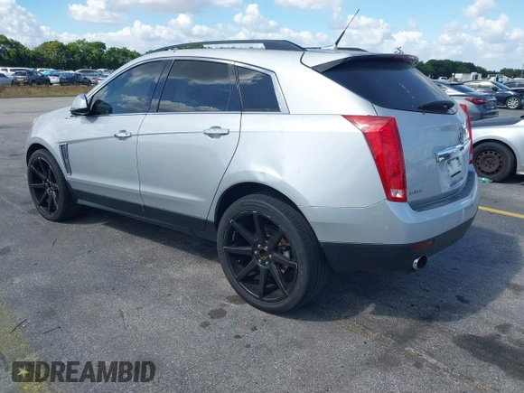 2013 Cadillac SRX z VIN 3GYFNAE32DS512534, wystawiony jako IAAI lot #41596602 z przebiegiem 193 131 mil mil oraz . Historia ofert i sprzedaży dostępna na DreamBid. Obrazek 3.