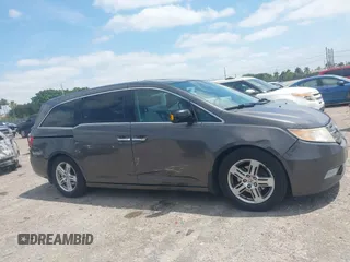 2012 Honda Odyssey Touring with VIN 5FNRL5H90CB088536, listed as a IAAI auction lot 42102008 with 283,350 mi miles and . Bid and sale history available at DreamBid. Image 13.