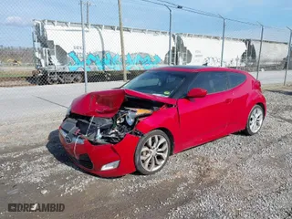 2013 Hyundai Veloster w/Black Int with VIN KMHTC6AD8DU109826, listed as a IAAI auction lot 41950945 with 126,216 mi miles. Bid and sale history available at carsss.com. Image 2.