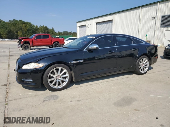2015 Jaguar XJ with VIN SAJWA1CZ7F8V83167, listed as a Copart auction lot 74991144 with 94,502 mi miles and Salvage Title. Bid and sale history available at carsss.com. Image 1.