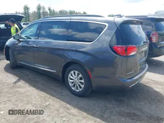 2017 Chrysler Pacifica Touring L with VIN 2C4RC1BGXHR667397, listed as a IAAI auction lot 42085117 with 63,996 mi miles and . Bid and sale history available at DreamBid. Image 3.