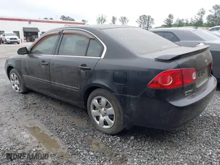 2008 Kia Optima LX with VIN KNAGE123885235142, listed as a IAAI auction lot 42112119 with 145,410 mi miles. Bid and sale history available at carsss.com. Image 3.
