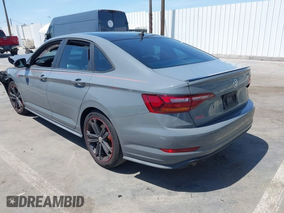 2019 Volkswagen Jetta GLI S z VIN 3VW6T7BU9KM153175, wystawiony jako IAAI lot #42099719 z przebiegiem 90 608 mil mil oraz . Historia ofert i sprzedaży dostępna na DreamBid. Obrazek 3.