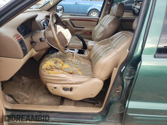 1999 Jeep Grand Cherokee Limited with VIN 1J4GW68S1XC744666, listed as a Copart auction lot 88337895 with 243,480 mi miles and Salvage Title. Bid and sale history available at carsss.com. Image 7.