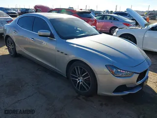 2015 Maserati Ghibli with VIN ZAM57XSA7F1135961, listed as a IAAI auction lot 40831583 with 89,671 mi miles. Bid and sale history available at carsss.com. Image 1.