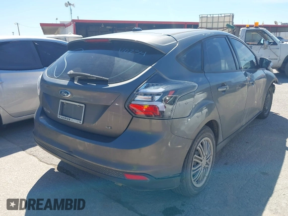 2012 Ford Focus SE with VIN 1FAHP3K21CL108392, listed as a IAAI auction lot 42223310 with 199,964 mi miles and . Bid and sale history available at carsss.com. Image 4.