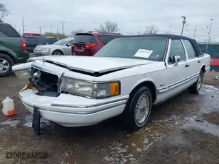 1994 Lincoln Town Car Executive with VIN 1LNLM81WXRY695472, listed as a IAAI auction lot 42017751 with 118,072 mi miles. Bid and sale history available at carsss.com. Image 2.