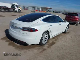 2020 Tesla Model S Long Range with VIN 5YJSA1E23LF360441, listed as a IAAI auction lot 41312865 with 68,967 mi miles and . Bid and sale history available at DreamBid. Image 6.
