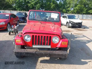 2000 Jeep Wrangler SE with VIN 1J4FA29P6YP775127, listed as a IAAI auction lot 42377387 with Not provided miles and . Bid and sale history available at DreamBid. Image 6.