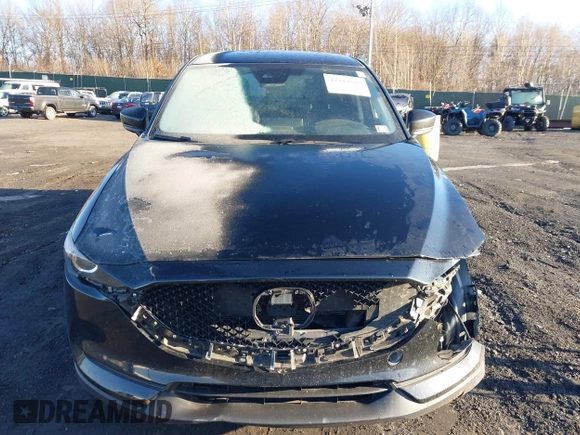 2021 Mazda CX-5 Touring with VIN JM3KFBCM2M1303063, listed as a IAAI auction lot 41814604 with 36,116 mi miles. Bid and sale history available at carsss.com. Image 12.