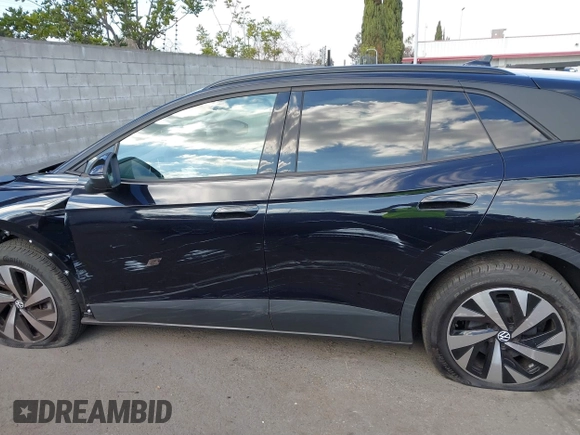 2023 Volkswagen ID.4 Pro z VIN 1V2DNPE85PC028748, wystawiony jako IAAI lot #41348983 z przebiegiem 7 434 mil mil oraz . Historia ofert i sprzedaży dostępna na DreamBid. Obrazek 14.
