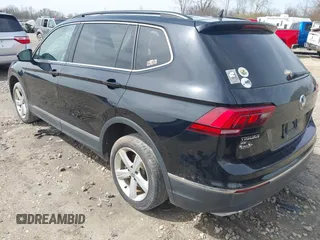 2021 Volkswagen Tiguan SE with VIN 3VV2B7AX4MM050282, listed as a IAAI auction lot 42124808 with 80,082 mi miles and . Bid and sale history available at DreamBid. Image 3.
