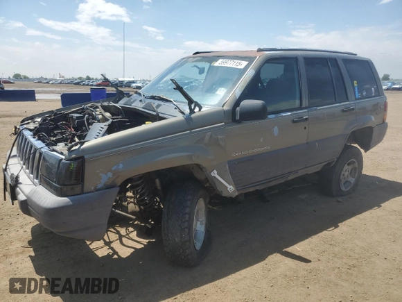 1997 Jeep Grand Cherokee Laredo z VIN 1J4GZ58S6VC636803, wystawiony jako Copart lot #59977115 z przebiegiem Nie podano mil oraz Szkoda całkowita • Salvage title. Historia ofert i sprzedaży dostępna na DreamBid. Obrazek 1.