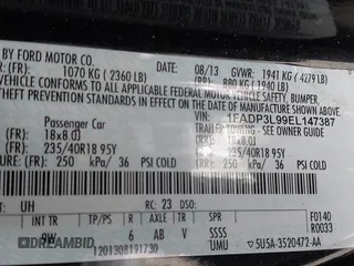 2014 Ford Focus ST with VIN 1FADP3L99EL147387, listed as a IAAI auction lot 41300582 with Not Provided miles and . Bid and sale history available at carsss.com. Image 9.