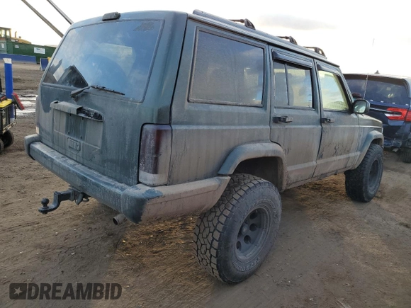 1997 Jeep Cherokee Country with VIN 1J4FJ78SXVL566804, listed as a Copart auction lot 88557395 with 216,230 mi miles and Salvage title. Bid and sale history available at DreamBid. Image 3.