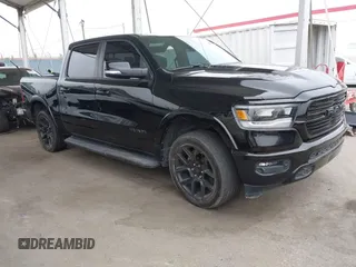 2021 Ram 1500 Laramie with VIN 1C6SRFJT9MN542322, listed as a IAAI auction lot 42455038 with 68,601 mi miles and . Bid and sale history available at DreamBid. Image 1.