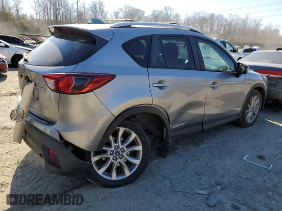 2015 Mazda CX-5 Grand Touring with VIN JM3KE4DY5F0460465, listed as a Copart auction lot 46392605 with 103,185 mi miles and Salvage Title. Bid and sale history available at carsss.com. Image 3.