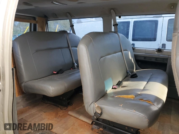 2010 Ford Econoline Passenger XL with VIN 1FMNE1BWXADA30935, listed as a Copart auction lot 77912734 with 153,775 mi miles and Salvage Title. Bid and sale history available at DreamBid. Image 10.