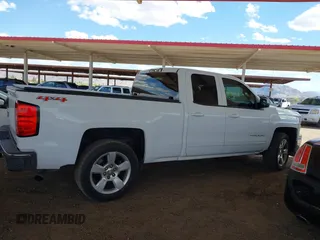 2015 Chevrolet Silverado 1500 LT with VIN 1GCVKREC1FZ415386, listed as a IAAI auction lot 42142990 with 165,409 mi miles and . Bid and sale history available at DreamBid. Image 13.