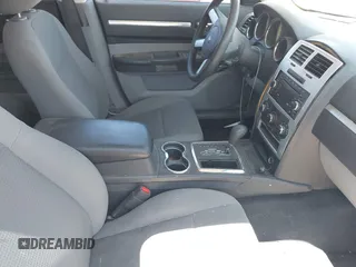 2010 Dodge Charger SXT with VIN 2B3CA3CV5AH297994, listed as a IAAI auction lot 42153457 with 157,017 mi miles. Bid and sale history available at carsss.com. Image 5.