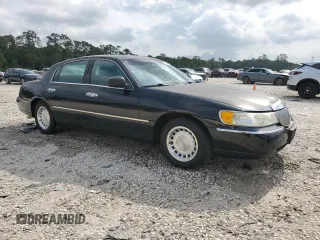 2001 Lincoln Town Car Executive z VIN 1LNHM81W11Y647756, wystawiony jako Copart lot #54741135 z przebiegiem 191 580 mil mil oraz Szkoda całkowita • Salvage title. Historia ofert i sprzedaży dostępna na DreamBid. Obrazek 4.