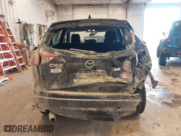 2015 Mazda CX-5 Sport with VIN JM3KE4BY0F0542655, listed as a IAAI auction lot 41471568 with 165,386 mi miles. Bid and sale history available at carsss.com. Image 16.