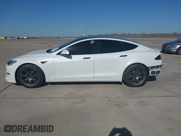 2022 Tesla Model S Plaid with VIN 5YJSA1E69NF486471, listed as a IAAI auction lot 41228818 with 49,207 mi miles and . Bid and sale history available at carsss.com. Image 14.