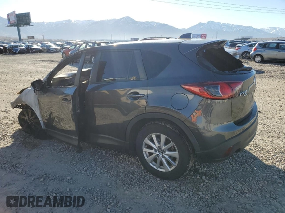 2015 Mazda CX-5 Touring with VIN JM3KE4CYXF0515106, listed as a Copart auction lot 50451185 with 0 mi miles and Salvage Title. Bid and sale history available at carsss.com. Image 2.
